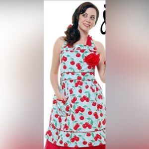 Cherry Print Apron With A Red Rose Pin And A Red Stretchy Chef’s Hat